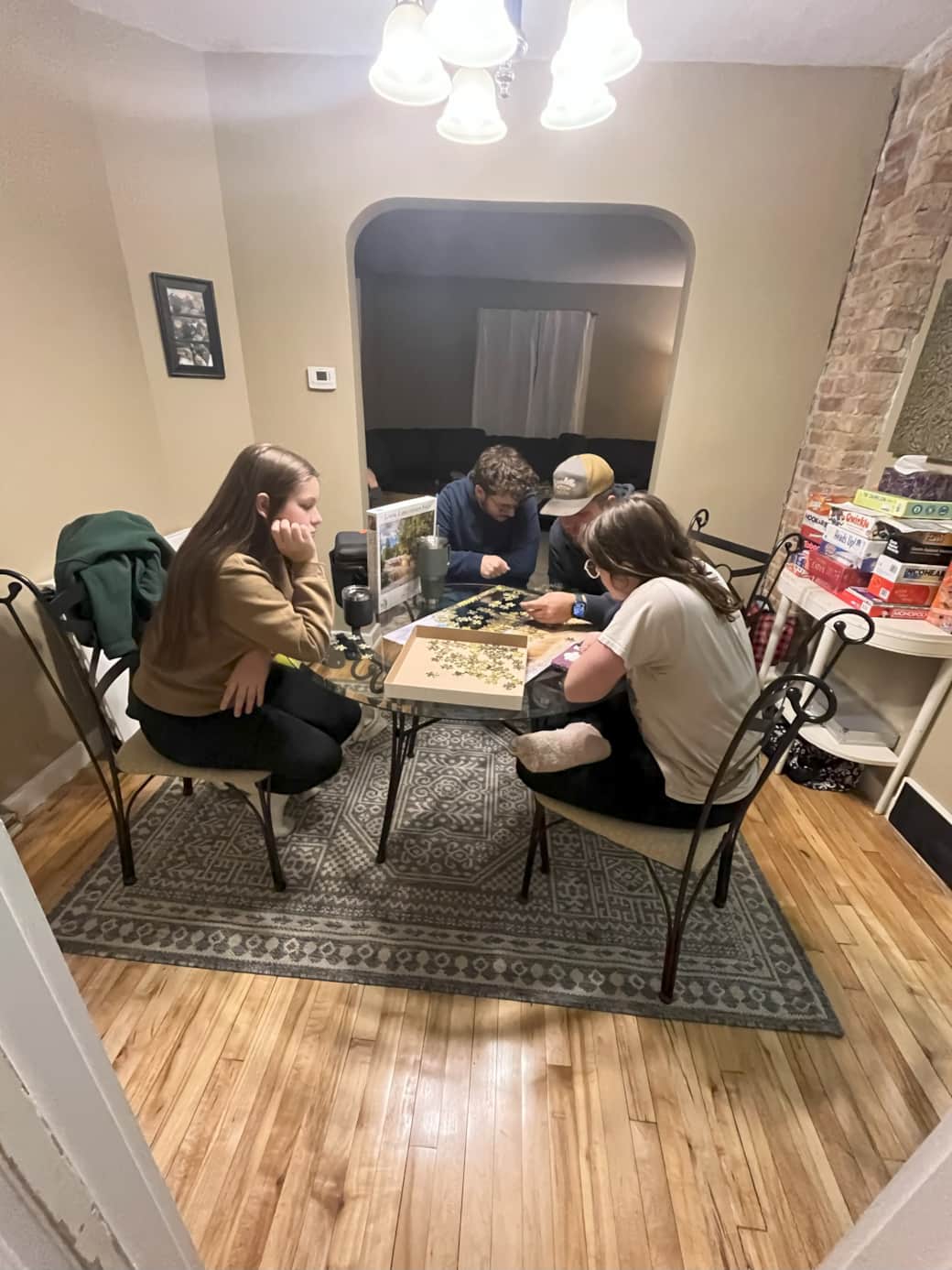 Family puzzle time view to living room