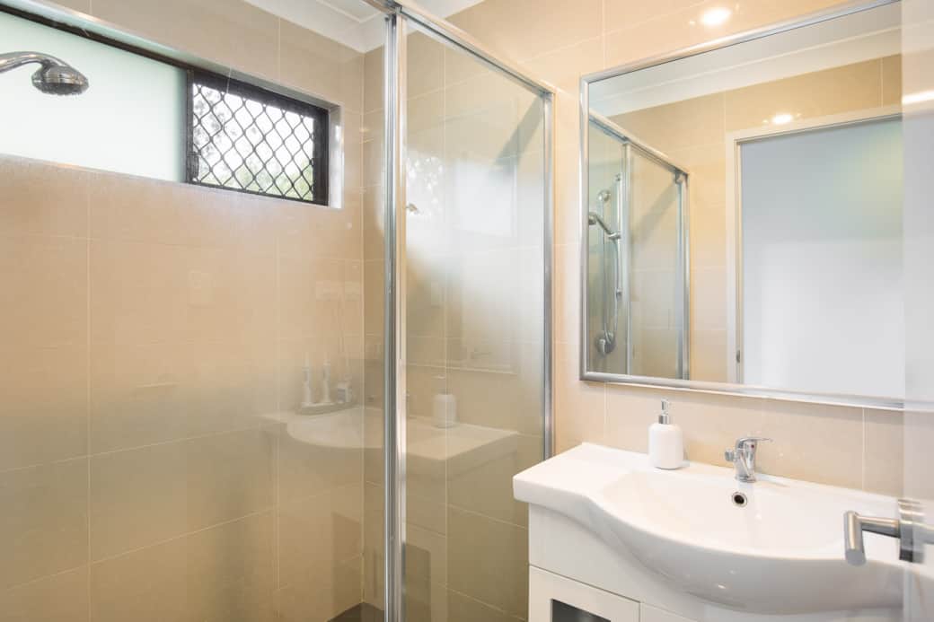 Bathroom: Stylish bathroom with walk-in shower, vanity, and clean finishes
