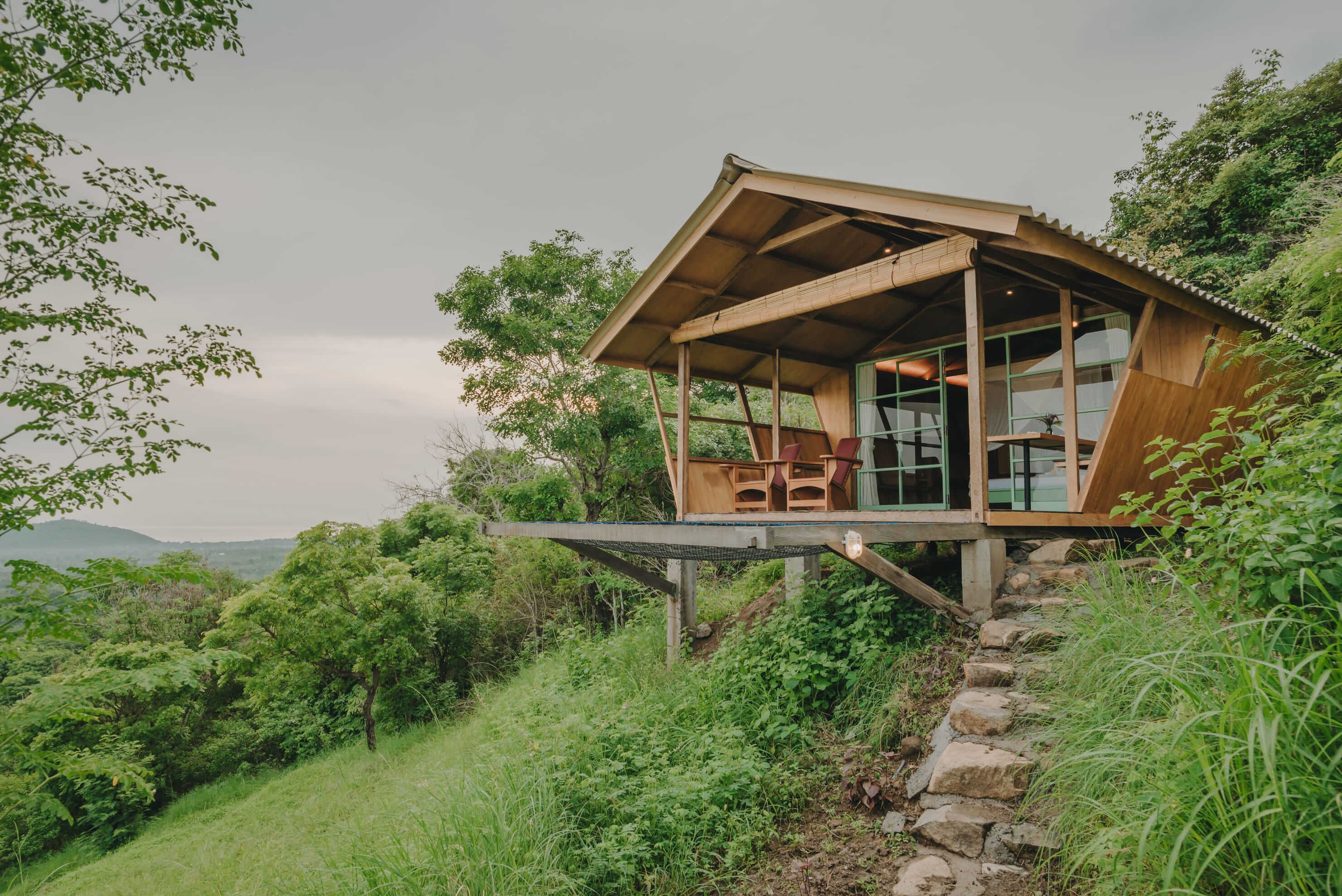 Rustic cabin surrounded by trees in a peaceful natural setting