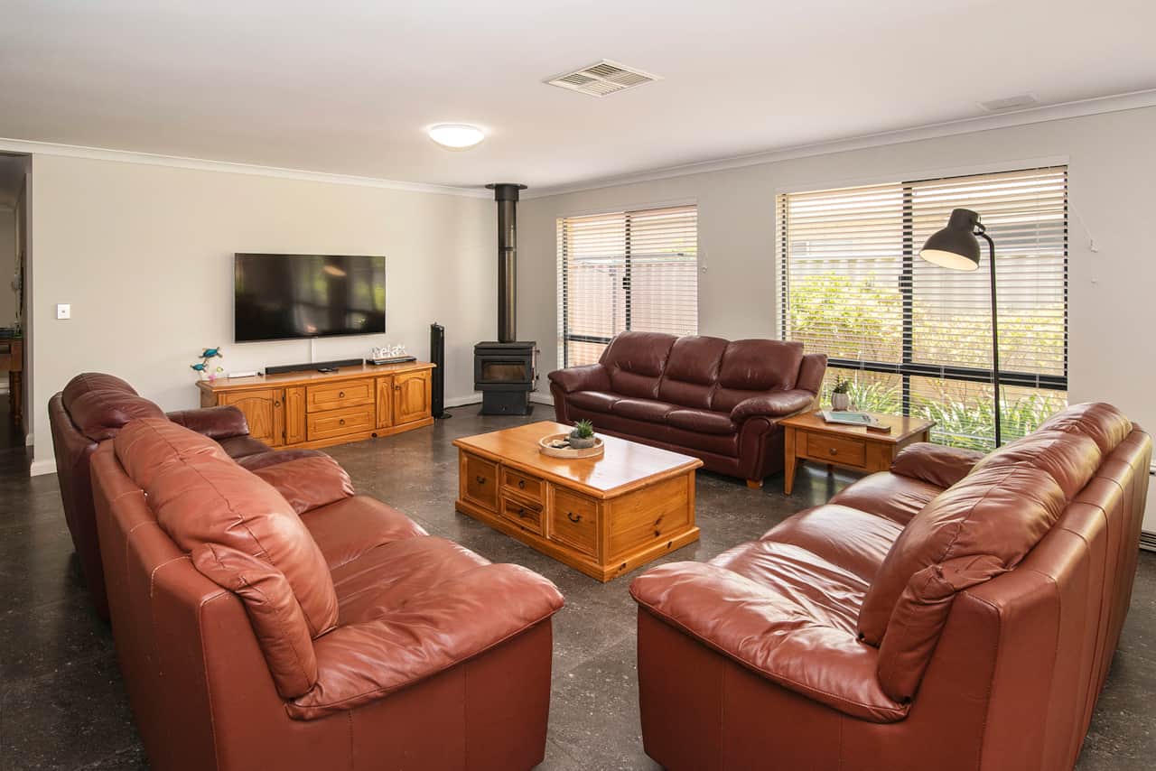 Large living room with 60 inch TV and fireplace