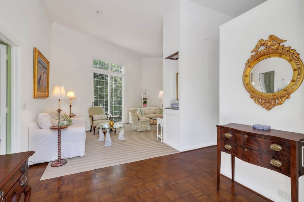 The entryway into the home opens up into a foyer, and the Great Room, and features gorgeous antiques
