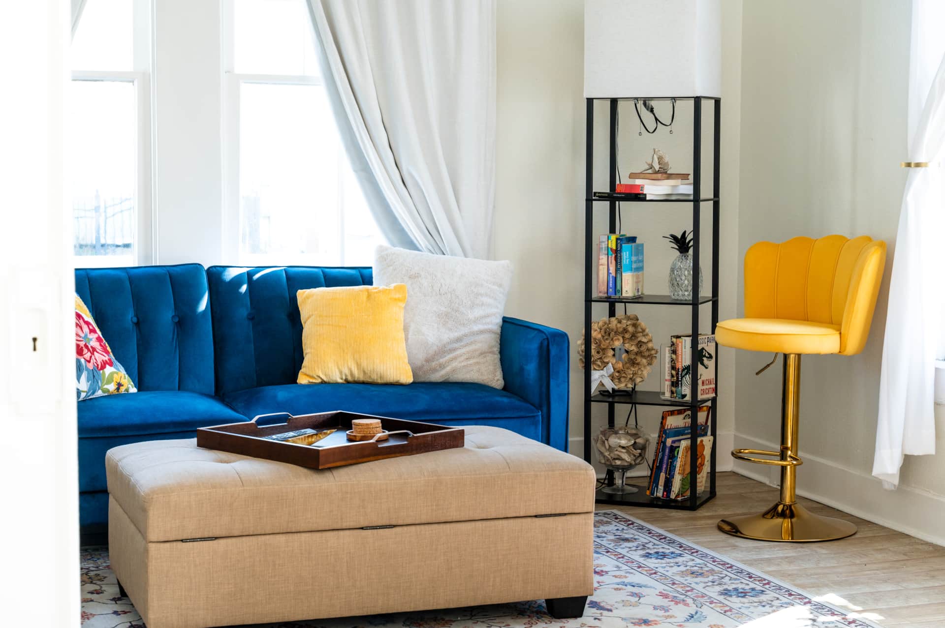 Alternate view of the living room layout with seating and open flow at White Magnolia Galveston