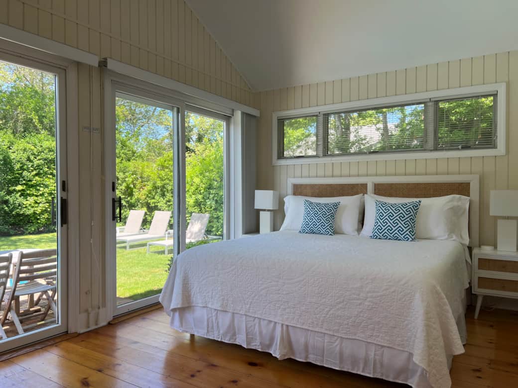 Primary bedroom with California king bed, stylish, new furnishings, tv, pool view, & private bath Primary bedroom with California king bed, stylish, new furnishings, tv, pool view, & private bath