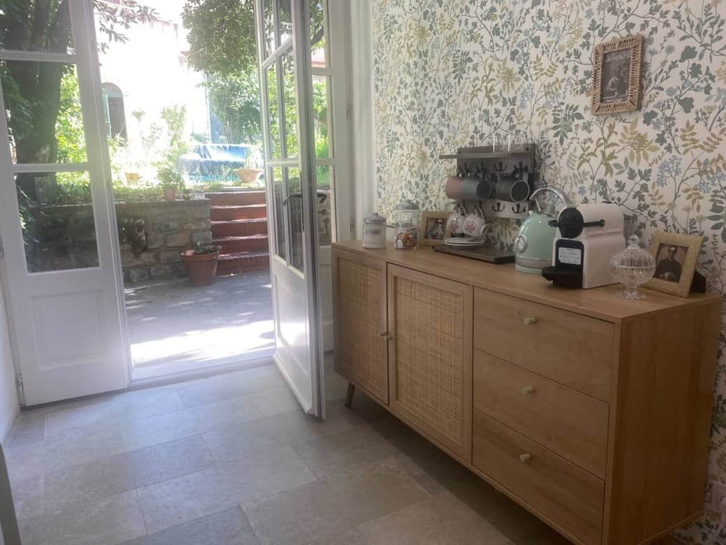 Bright entryway with garden access, elegant decor, and modern features in a historic Carcassonne hom Bright entryway with garden access, elegant decor, and modern features in a historic Carcassonne hom