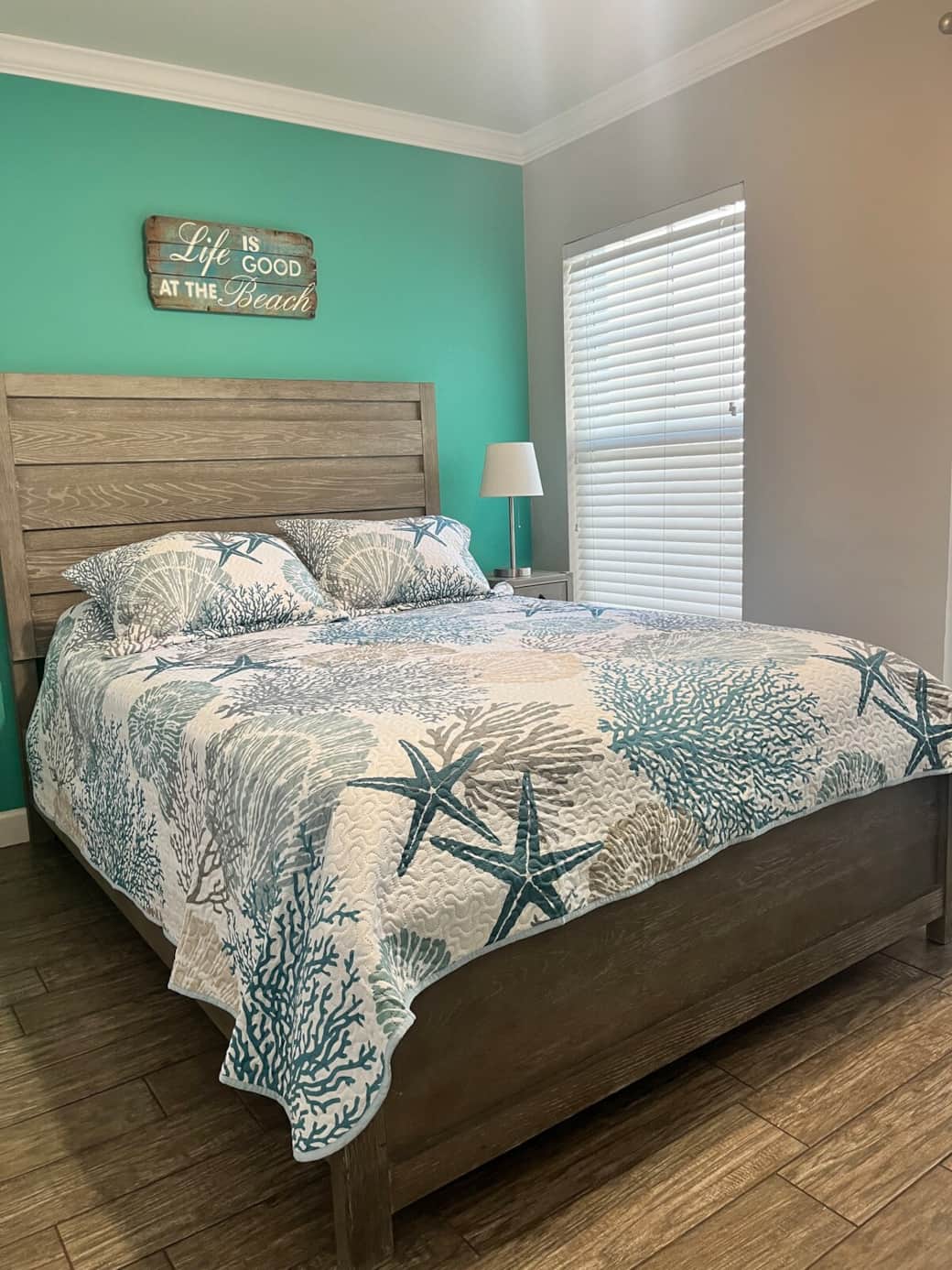 2nd bedroom w Queen size bed and French doors w curtains that leads to Florida room. Generous closet space and dresser