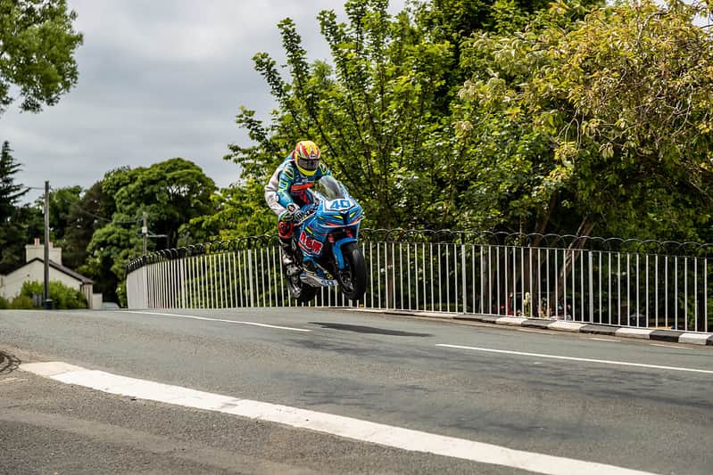 Isle of Man TT rider jumping Ballaugh Bridge at high speed (Credit Visit Isl of Man)