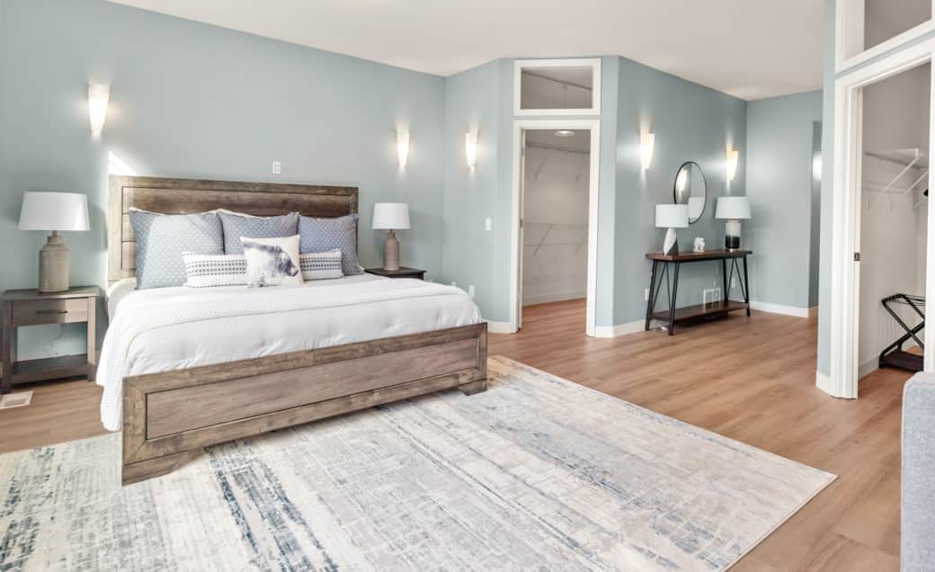 Primary bedroom close-up – crisp bedding and calming atmosphere.