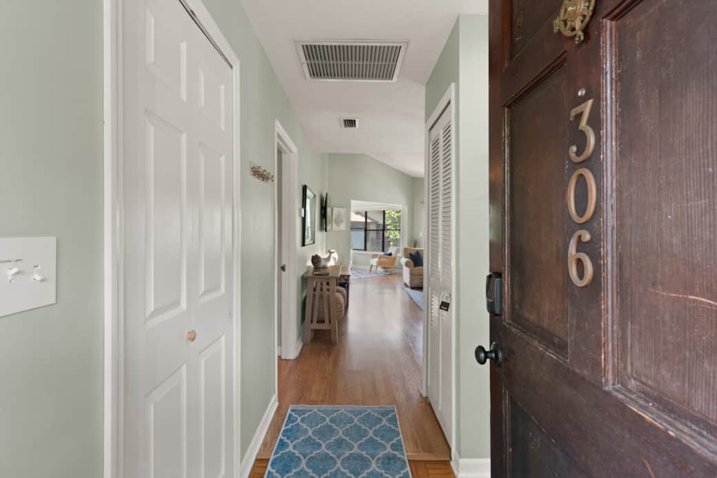 View from the front door of the condo, leading into the foyer. 