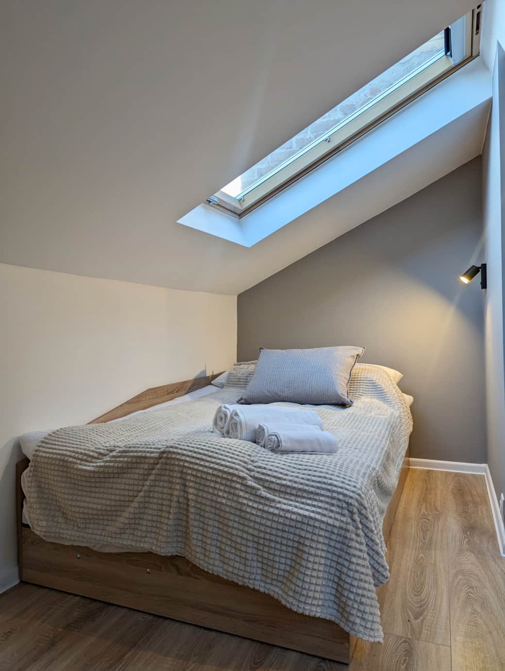 Very comfortable bed for two people like at home with a duvet, pillow and extra blanket.