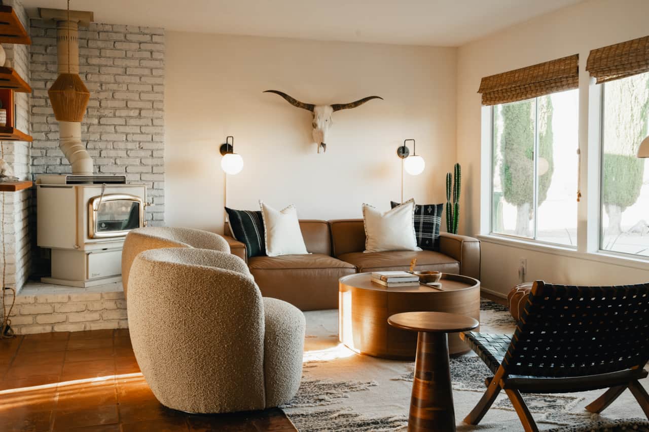 Cozy living room with a wood burning fireplace. Curl up with a cup of Joe here to watch the sunrise.