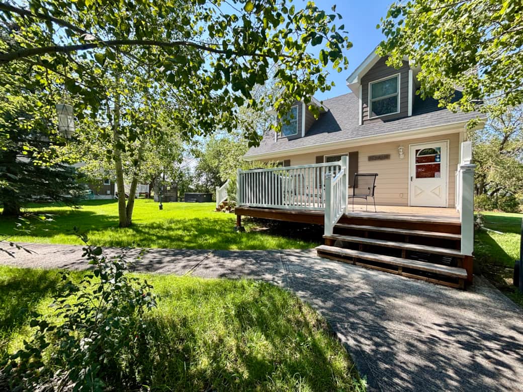 Aspen trees and luscious green scenery. Mature tree lined pathways and gardens.