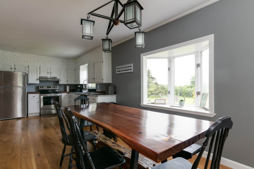 Open concept first floor; handmade Black Walnut live edge dining table to seat up to 10