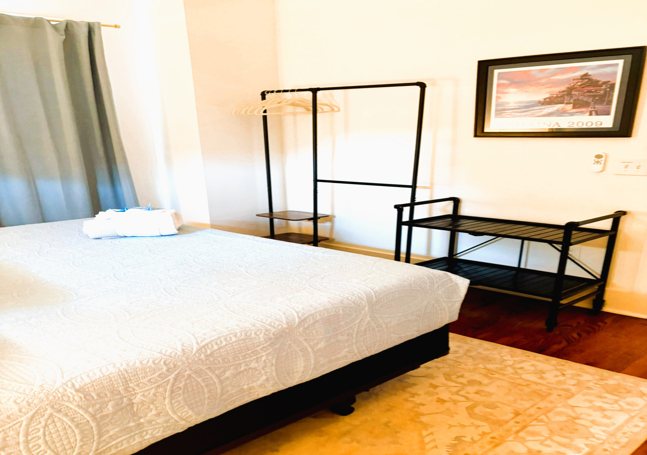 Close-up of premium linens on the queen bed in bedroom three at White Magnolia Galveston