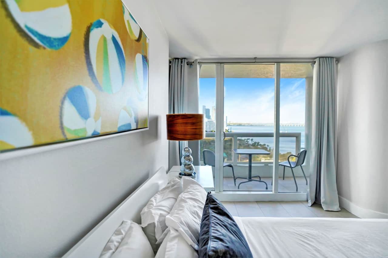 2nd bedroom, queen bed, Roku tv, balcony access