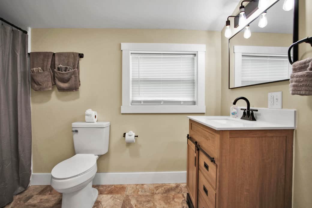 Bedroom 1- Queen bed, attached bathroom with walk in shower, hairdryer available