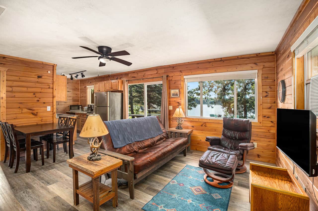 Knotty-pine living room with lake views and a Roku smart TV
