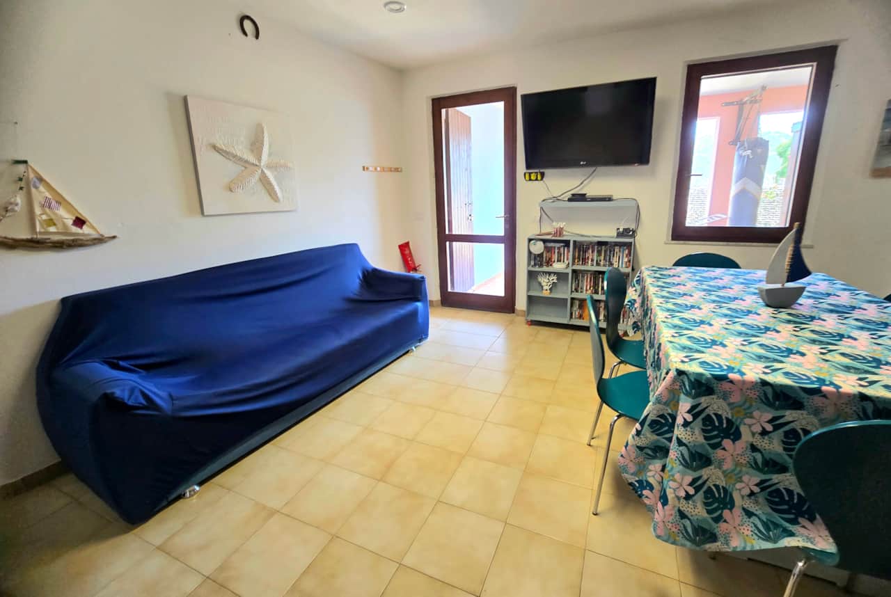 Living and dining room with sofa and table