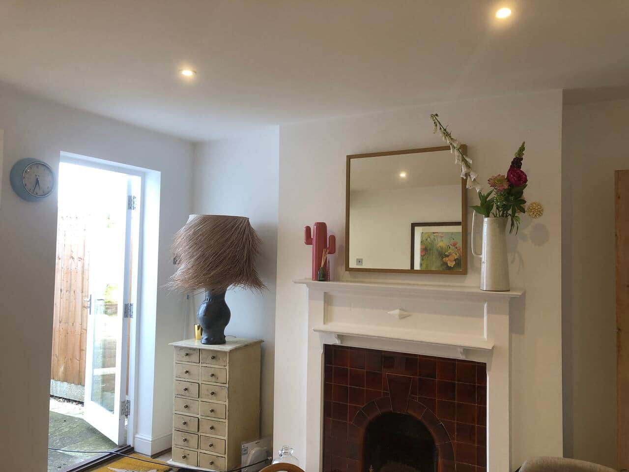 The rear reception room leads to the outside via a patio door. 