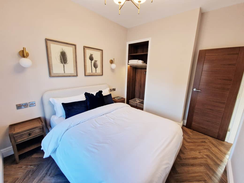 King size bedroom with fitted wardrobe and flat screen TV