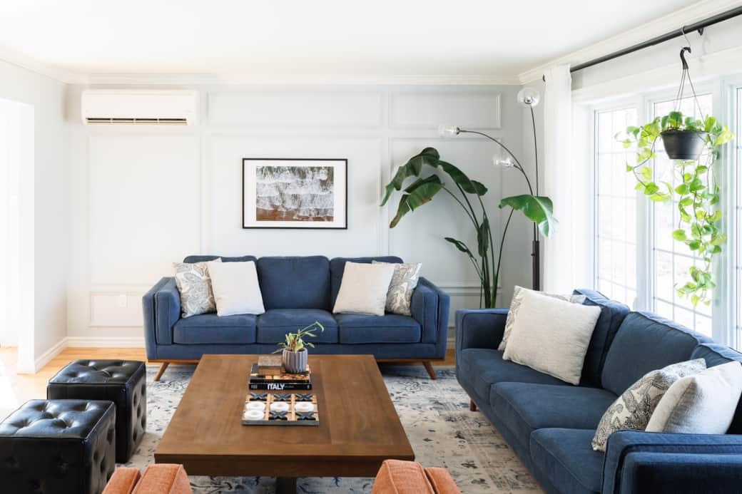 Light-filled living room with cozy seating and modern coastal style.