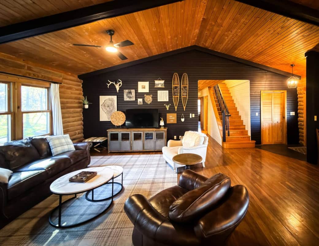 Spacious living room with Roku TV, gas fireplace, leads to the kitchen and dining. 