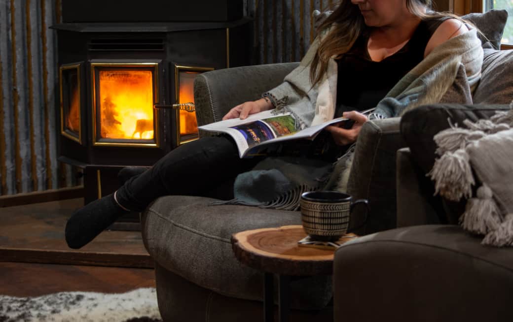 Lounge in the oversized swivel next to the pellet stove for a cozy evening!
