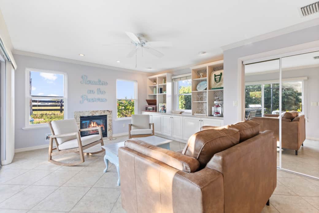 Large sunlit living space with gas fire place