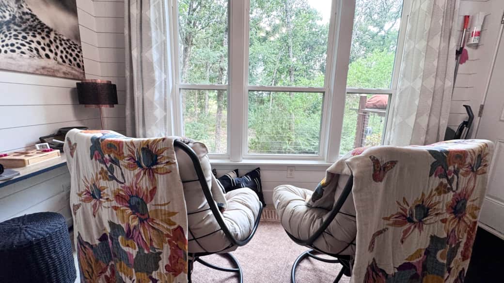 Look out the large picture windows from the cozy overstuffed chairs