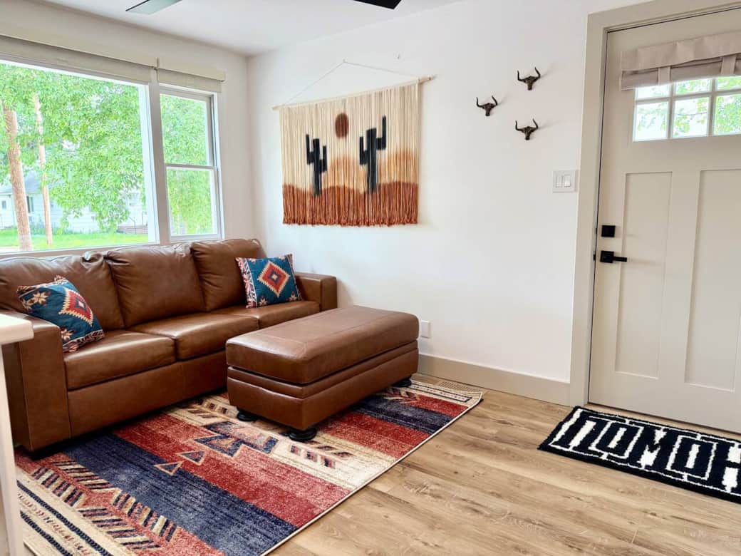 This sun-filled corner is perfect for morning coffee or afternoon lounging. Cozy up on the leather couch and watch your favorite shows on the smart TV. It’s Southwestern chic at its finest!