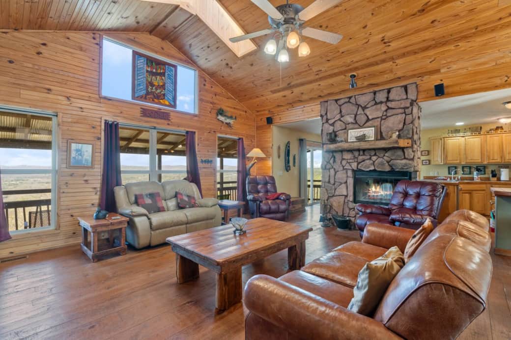 Massive windows fill the space with natural light and frame breathtaking views of the river and valley below.  A unique stained glass detail adds charm to this beautifully crafted space—truly a place to relax and take it all in. ☀️✨