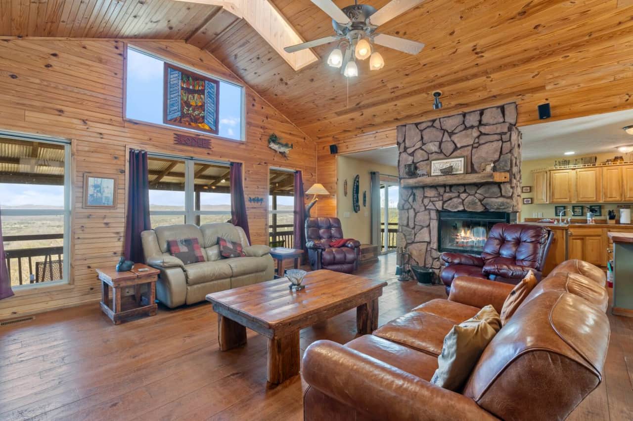 Massive windows fill the space with natural light and frame breathtaking views of the river and valley below.  A unique stained glass detail adds charm to this beautifully crafted space—truly a place to relax and take it all in. ☀️✨