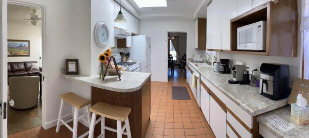 The kitchen is stocked with many cooking essentials.