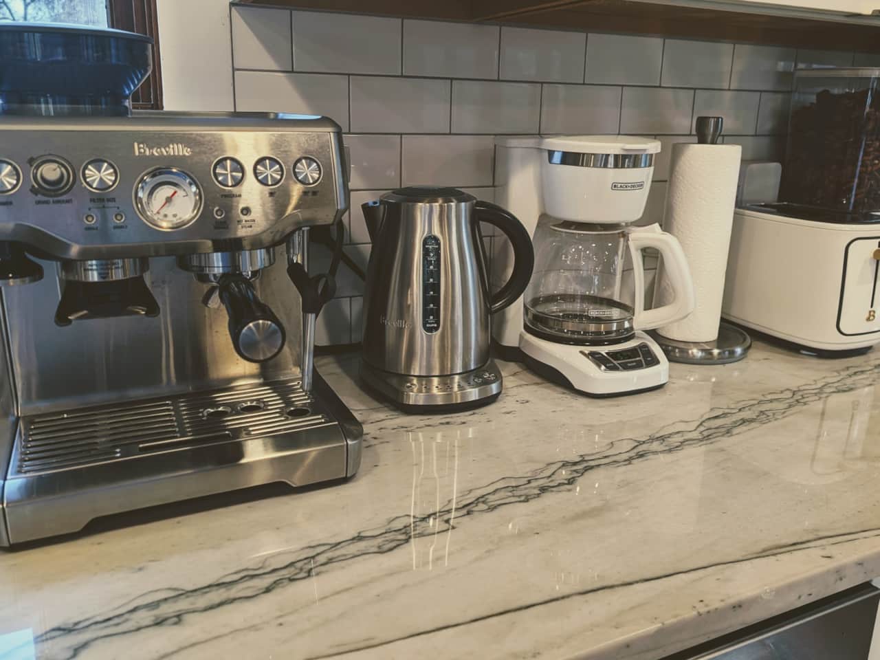 Espresso Machine, Electric Kettle, Coffee Pot along with coffee beans, decaf, tea, half & half and s