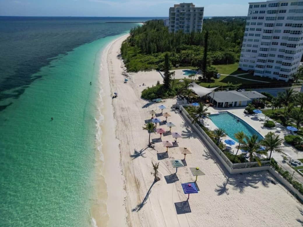 Aerial shot of private beach and umbrellas