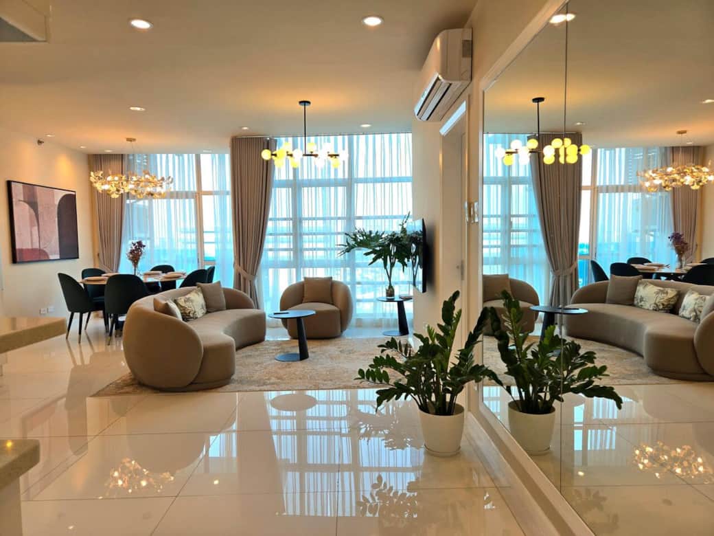 The inviting and spacious living area boasts a beautifully designed dining table that comfortably seats six, perfect for gatherings and memorable meals with family and friends. The inviting and spacious living area boasts a beautifully designed dining table that comfortably seats six, perfect for gatherings and memorable meals with family and friends.