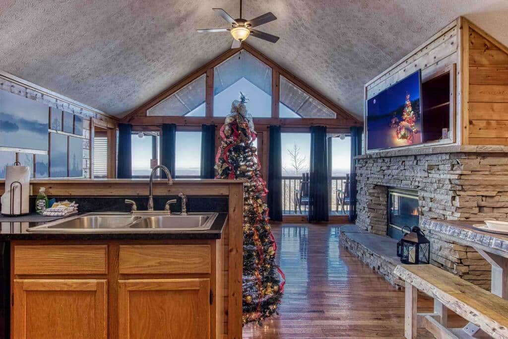 Open kitchen and living room with views to the back deck. Open kitchen and living room with views to the back deck.