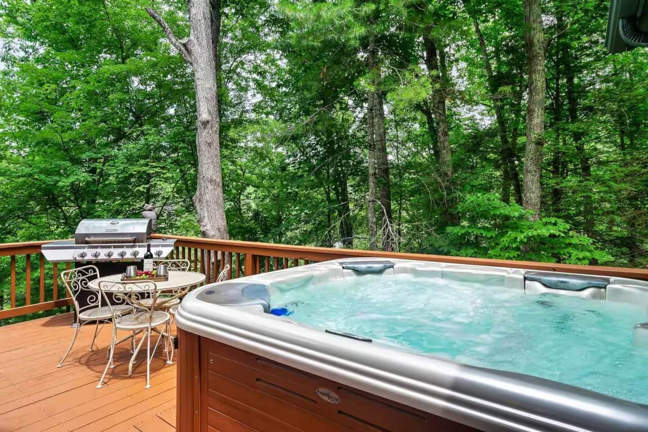 Relax in the private hot tub on the deck, surrounded by beautiful forest scenery