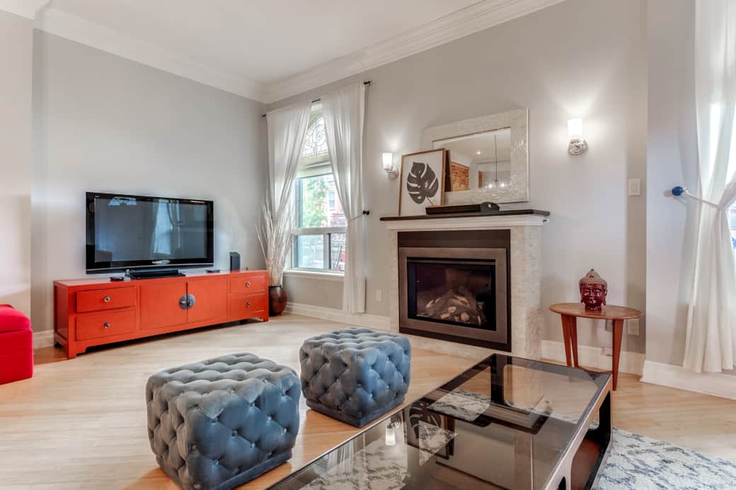 Sunlit Toronto short-term rental living room, airy and welcoming.