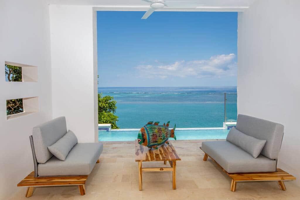 Outdoor living space and infinity pool when you enter the middle level