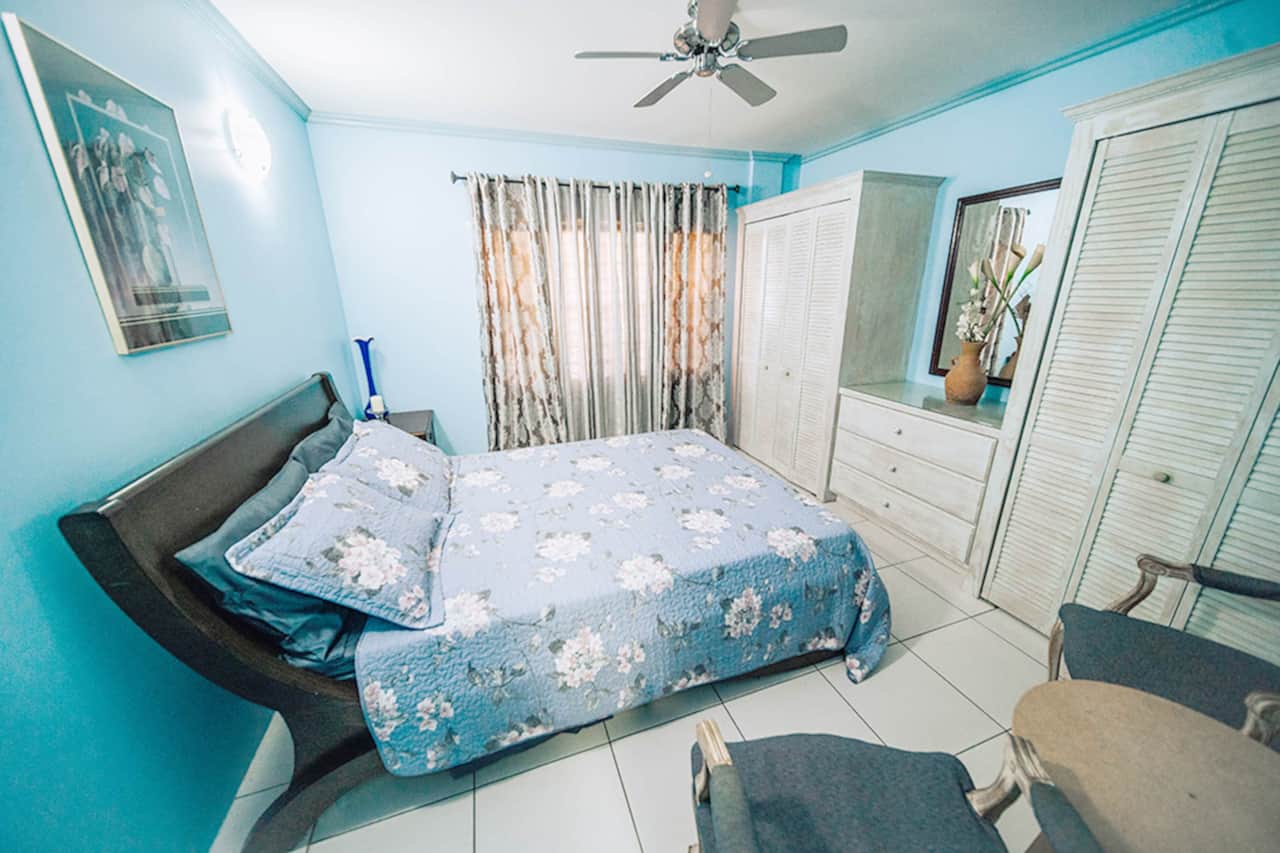 Master bedroom with a spacious queen bed.
