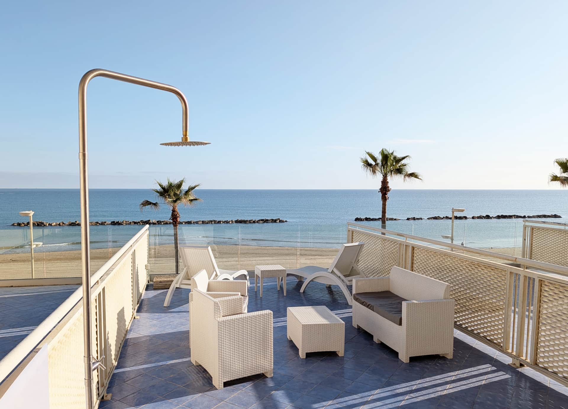 Private sea view terrace with outdoor lounge area at Terrazza Blu beachfront apartment in Termoli