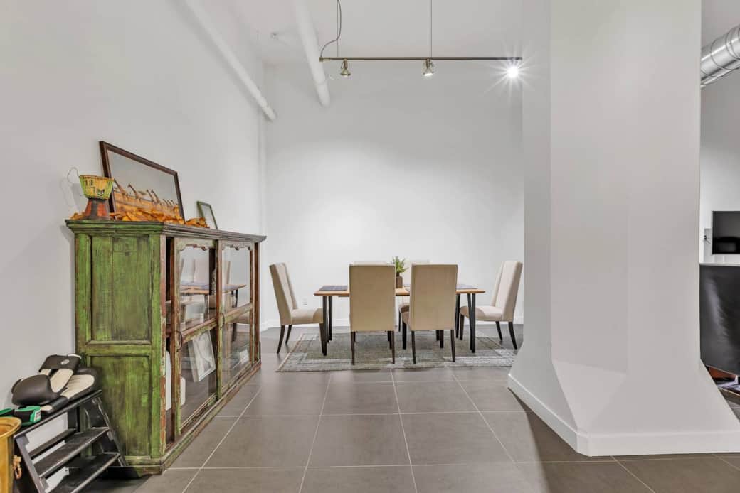 Contemporary dining area with a functional table and seating, perfect for meals or work.