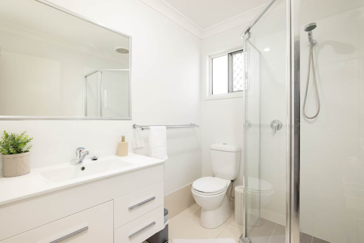 Bathroom: Stylish bathroom with walk-in shower, vanity, and clean finishes 