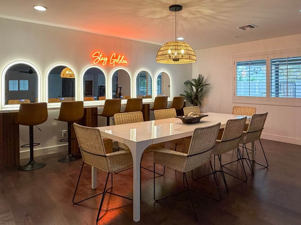 Indoor dining for eight with bar seating for six - perfect for shared meals, late-night card games, or gathering around the table with board games and poker chips.