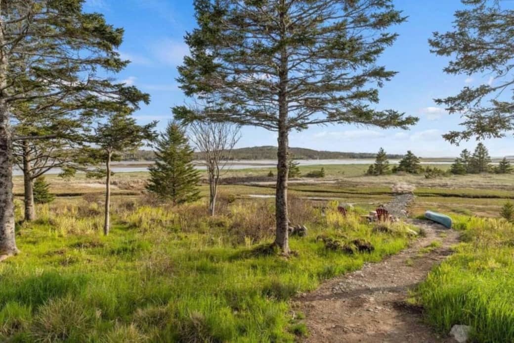 Tranquil waterfront meadow with chairs, fire pit & canoe access Tranquil waterfront meadow with chairs, fire pit & canoe access