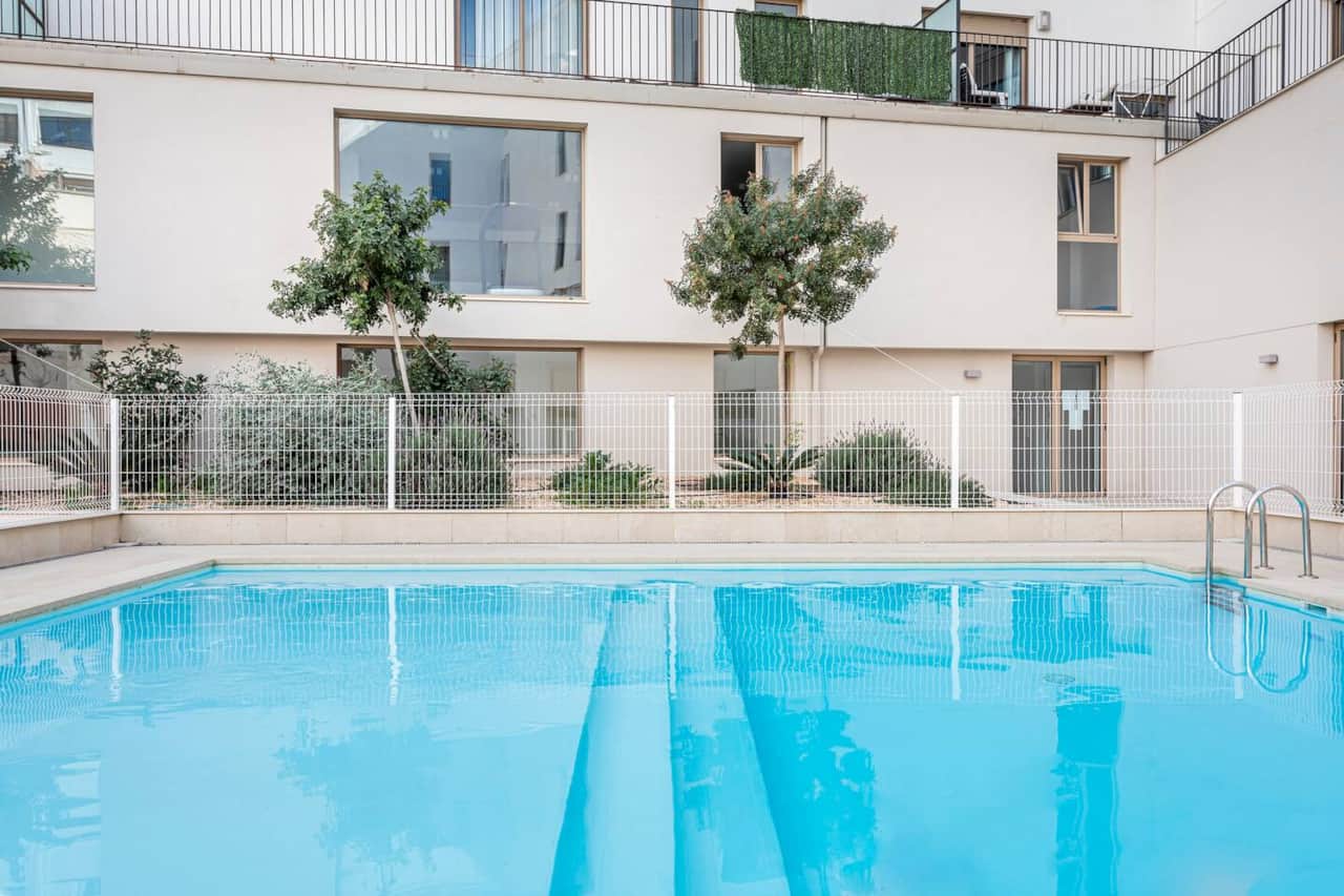 Access to a shared pool, with tables and sun loungers for sunbathing