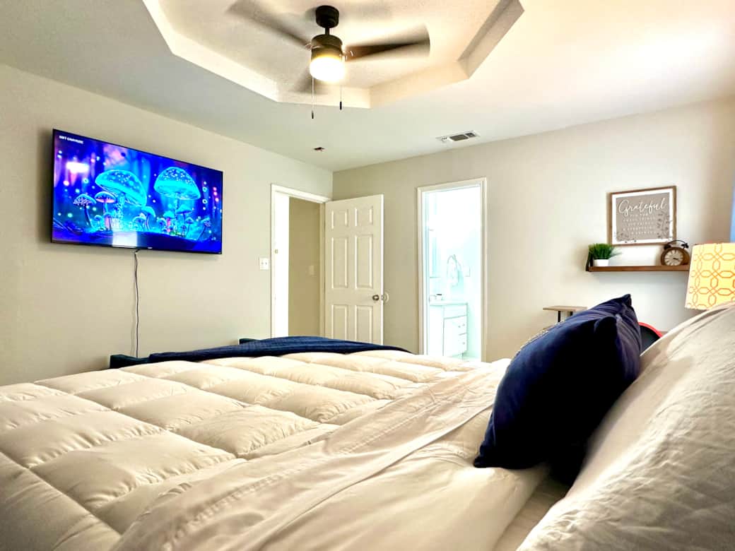 Bedroom has a smart TV to enjoy while relaxing in this comfortable king bed.