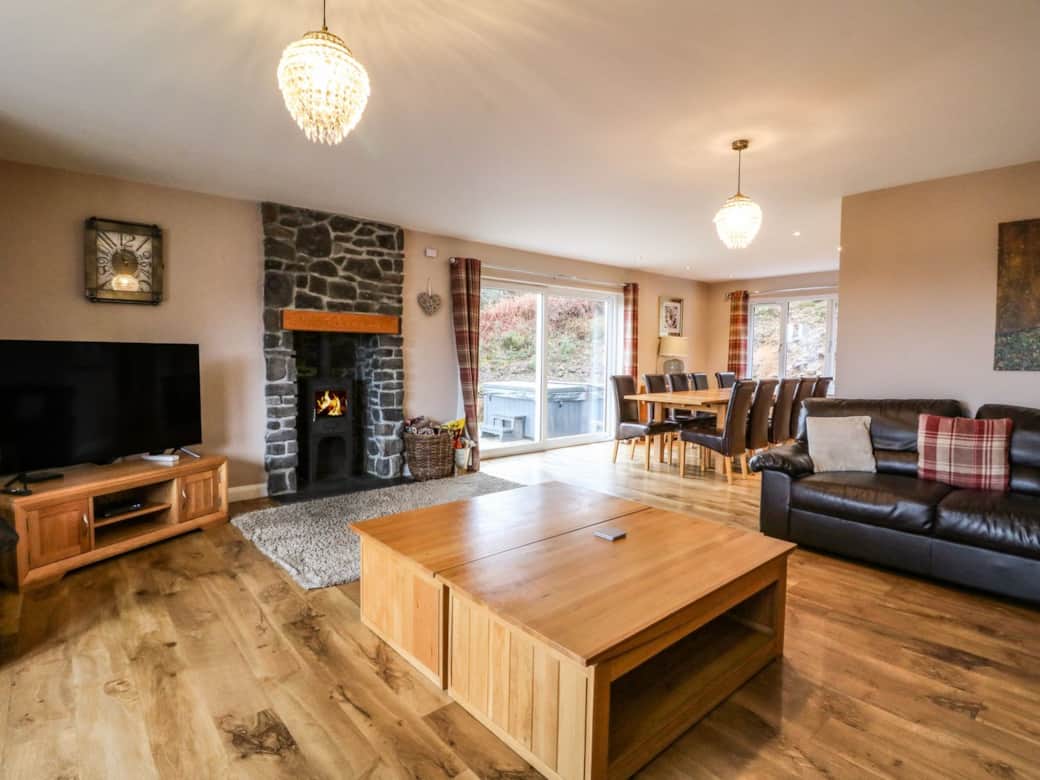 Spacious living area with log burner