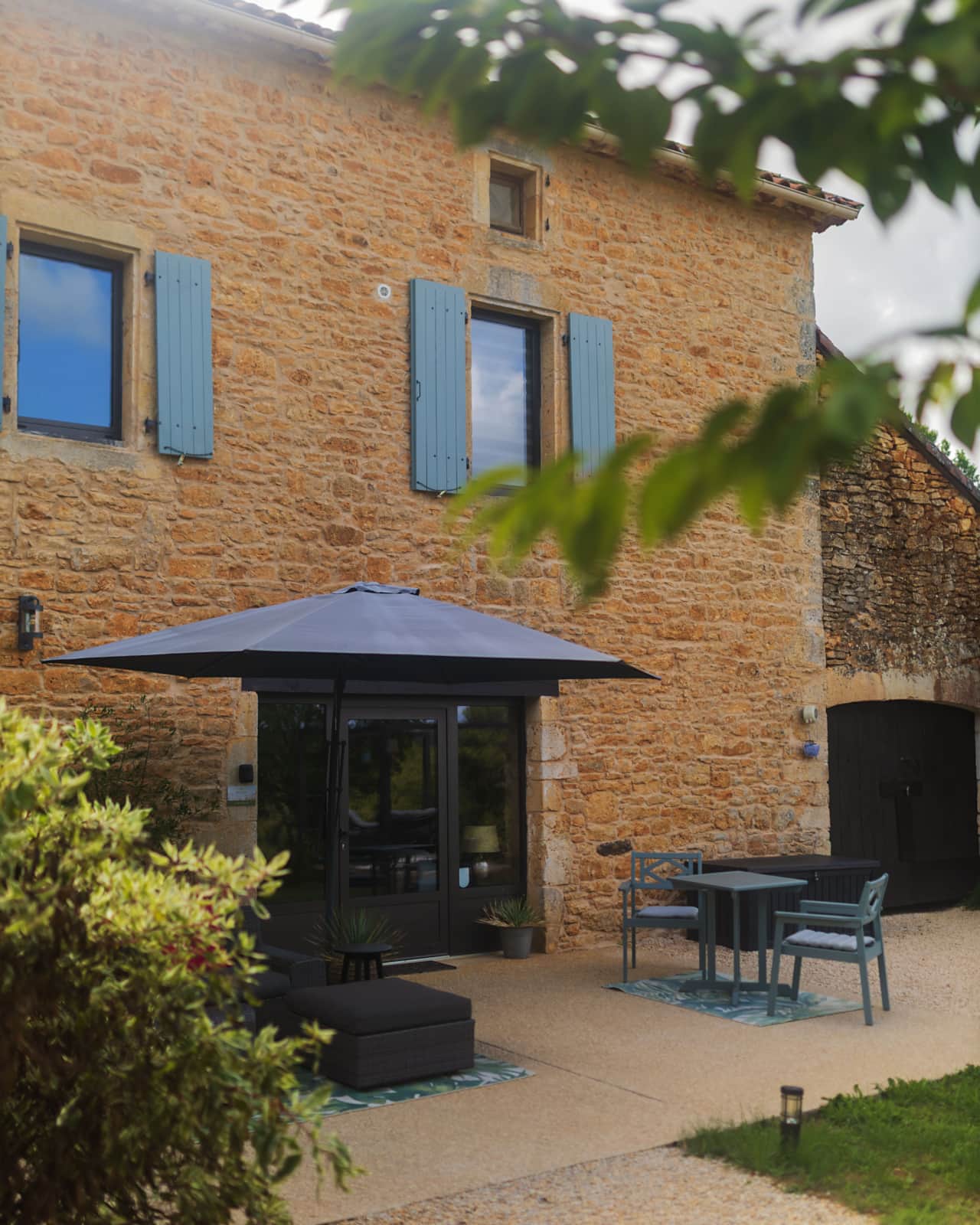 Private entrance and sunny terrace beside La Prairie's stone walls