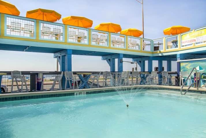 Float Pool and Patio Bar on the Galveston Seawall with ocean views and outdoor seating